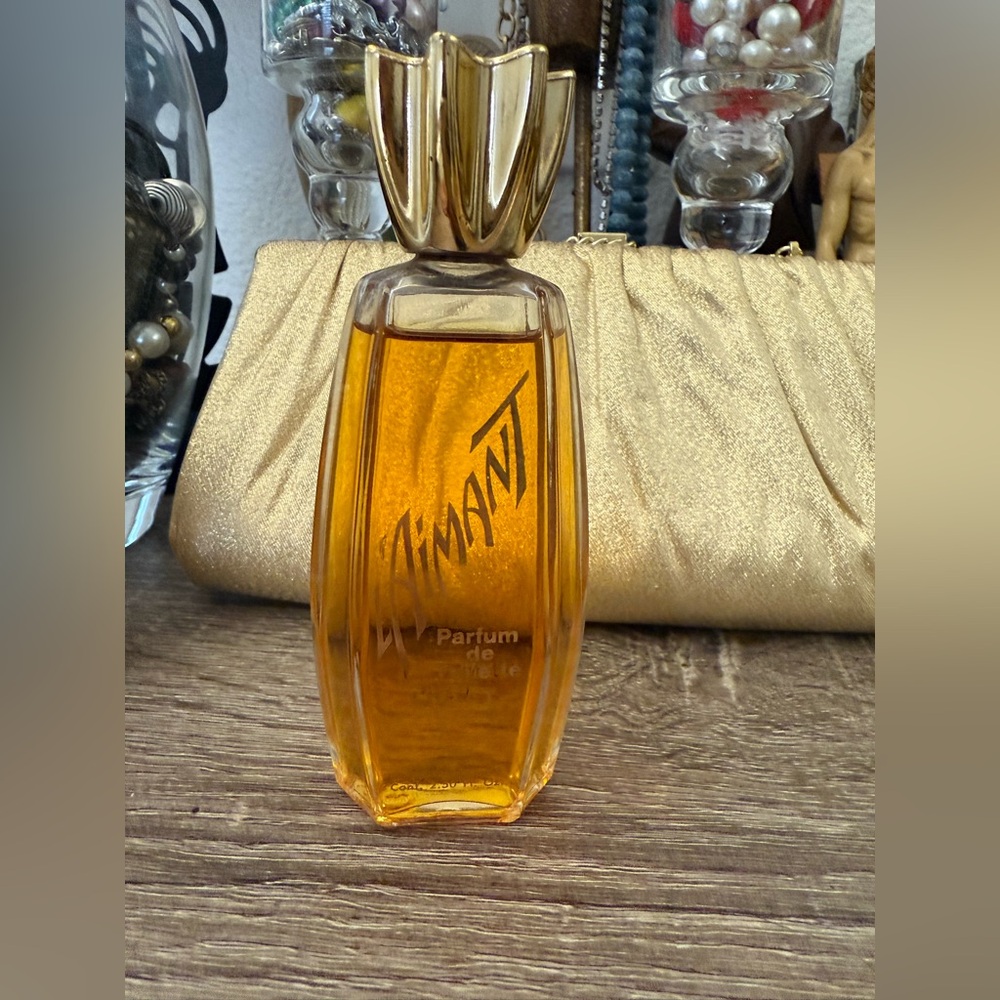 vintage bottle of L'Aimant Parfum de Toilette by Coty almost full